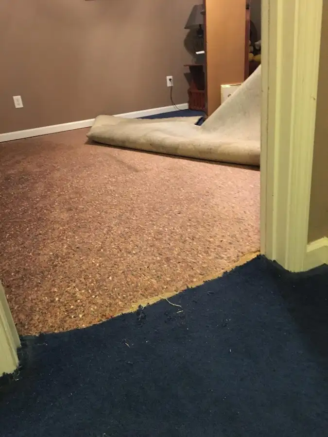 Carpet pad removal revealing water damage during Drying & Dehumidification in Kingsburg